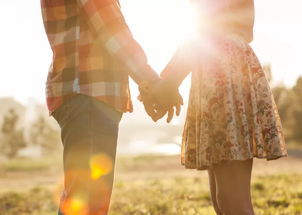 Couple holding hands during faith-based marriage counseling in Dallas, TX